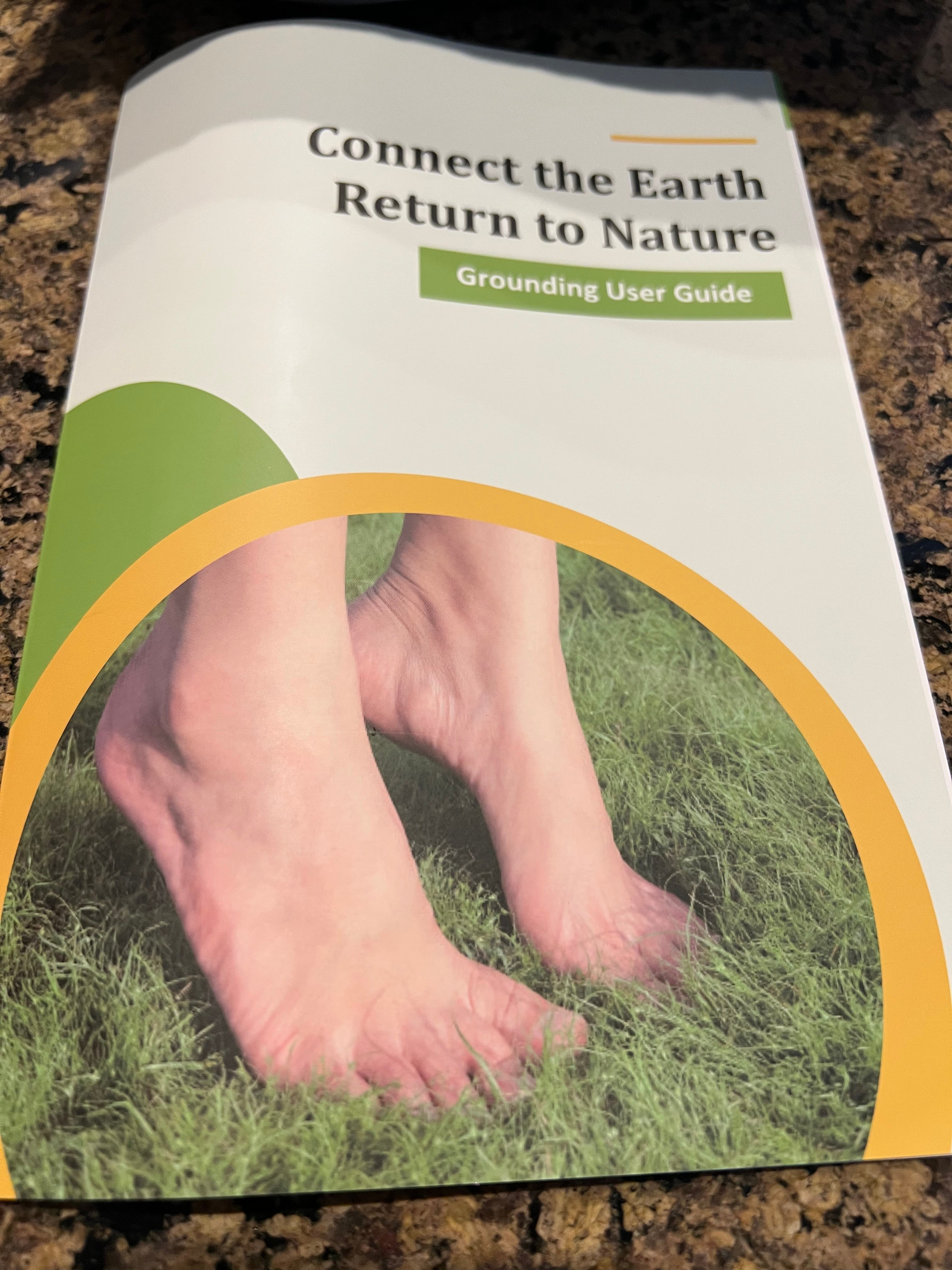 Book titled 'Connect the Earth, Return to Nature' with a cover showing feet on grass. well building connection