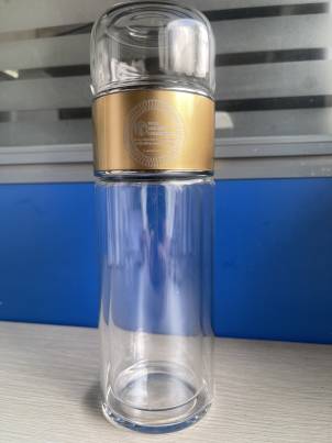 elegant glass tea infuser drinkware with stainless steel infuser. shown with a separation feature for tea water. From Well Building Connection