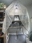 Organic Viscose Bamboo Bedding Sheets Set displayed on a bed at the well building connection location, 105 West Merchant Street, New Buffalo, Michigan. The display showcasing the fitted sheet, flat sheet, and pillowcases. The sheets are beige, and the image includes icons indicating various product features such as being eco-friendly, breathable, and soft. Well Building Connection Luxurious Bed Sheets