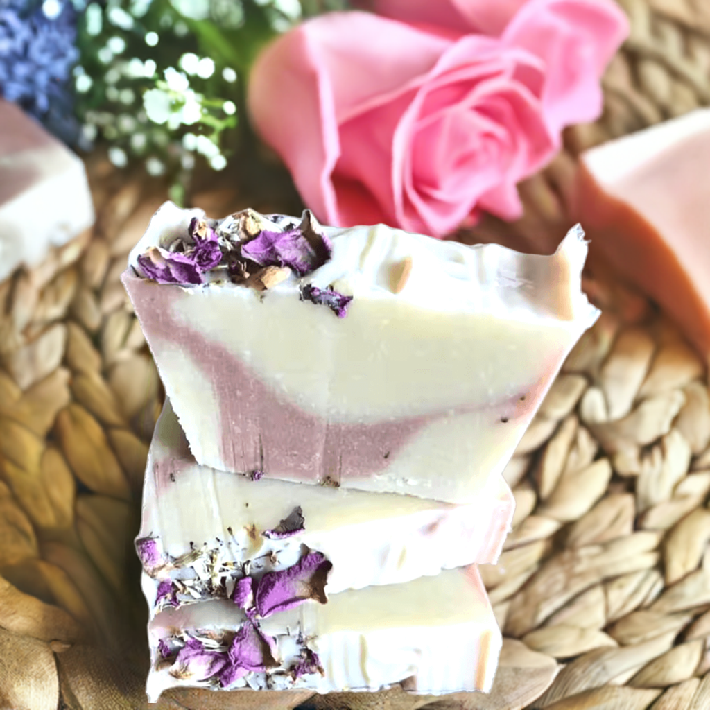 Handmade natural soap bar with lavender and rose petals embedded in the surface. Lavender Livy and Mia Rose Hand-Made Natural Soap

Indulge in the soothing, aromatic experience of Lavender Livy &amp; Mia Rose Handmade Natural Soap, crafted with love and care using 100% natural ingredients. This luxurious soap bar combines the calming essence of lavender with the delicate, floral notes of Mia rose, creating a relaxing and rejuvenating bathing experience. 
Handmade in small batches at Well Building Connection