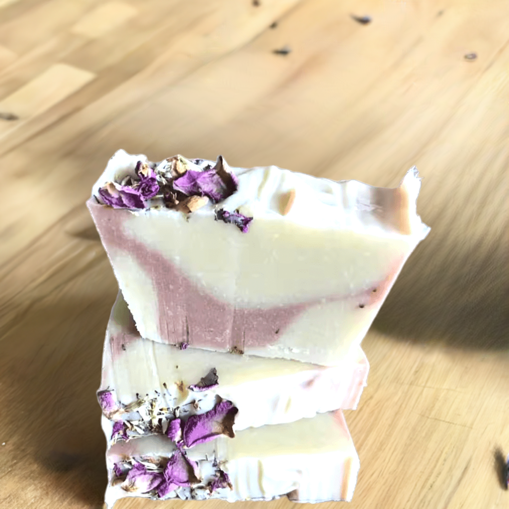 Handmade natural soap bar with lavender and rose petals embedded in the surface. Lavender Livy and Mia Rose Hand-Made Natural Soap

Indulge in the soothing, aromatic experience of Lavender Livy &amp; Mia Rose Handmade Natural Soap, crafted with love and care using 100% natural ingredients. This luxurious soap bar combines the calming essence of lavender with the delicate, floral notes of Mia rose, creating a relaxing and rejuvenating bathing experience.
Handmade in small batches at Well Building Connection