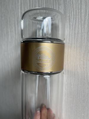 elegant glass tea infuser drinkware with stainless steel infuser. shown with a separation feature for tea water. From Well Building Connection