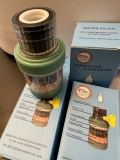 A five-layer drinking water faucet purification system, with components displayed alongside instructional materials. Water Purification - Five-Layer Tap Water Purification

Well Building Connection wants everyon to drink clean, safe, and great-tasting drinking water with our Five-Layer Drinking Water Faucet Purification System. Designed for maximum filtration efficiency, this advanced purifier removes impurities, contaminants, and harmful substances, delivering pure, refreshing water straight from your tap.